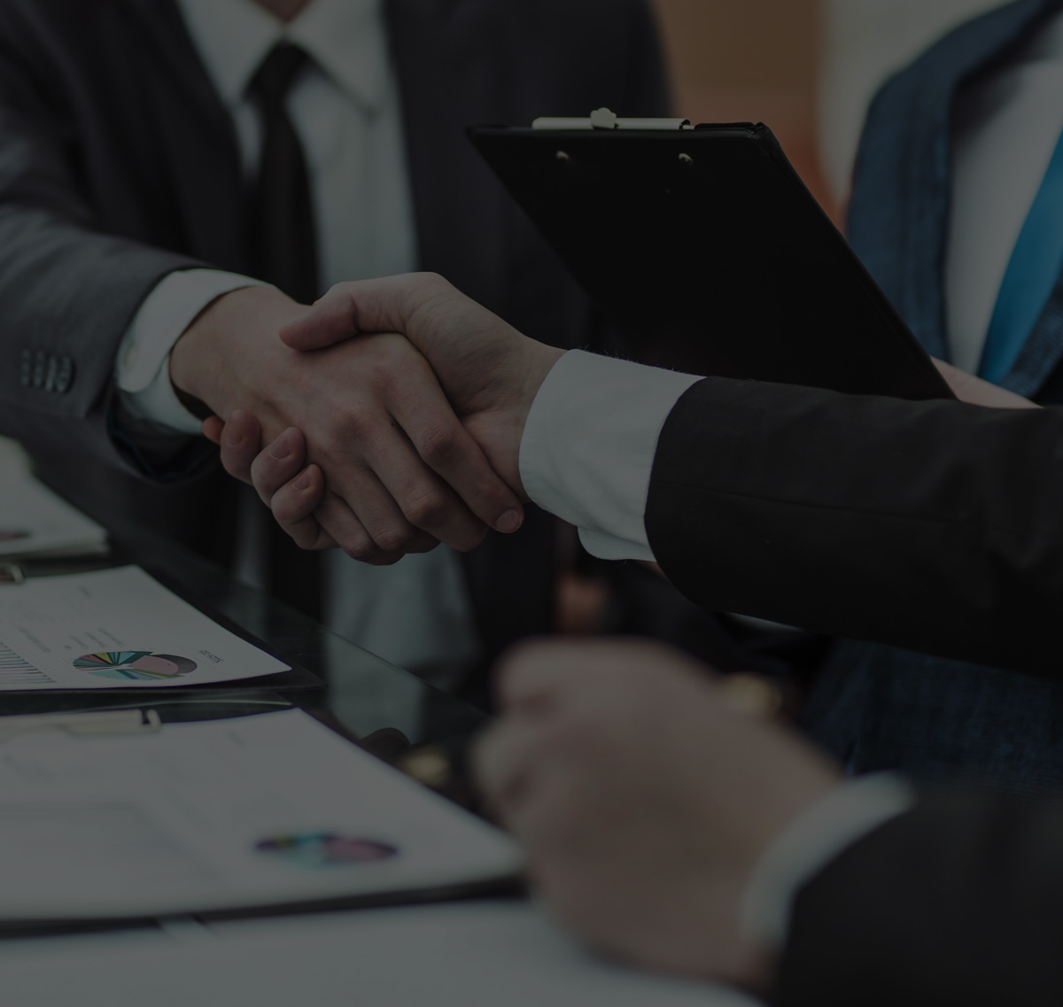 Businessmen agree a deal